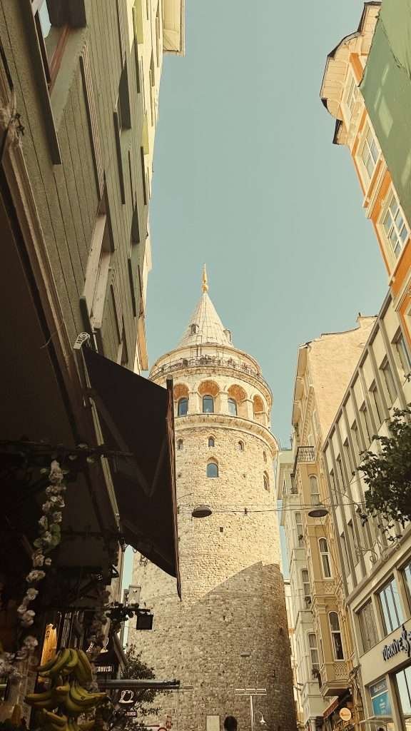 An old building with a clock tower in the background.